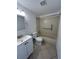 Clean bathroom with a bathtub, toilet and vanity at 4933 Filner St # 4933, New Port Richey, FL 34652