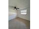 Bright bedroom featuring tile floors and a window at 4933 Filner St # 4933, New Port Richey, FL 34652