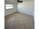 Spacious bedroom with tile flooring and ceiling fan at 4933 Filner St # 4933, New Port Richey, FL 34652