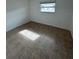 Spacious bedroom with tile floors and a window at 4933 Filner St # 4933, New Port Richey, FL 34652
