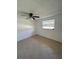 Bright bedroom featuring tile floors and a window at 4933 Filner St # 4933, New Port Richey, FL 34652