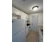 White kitchen features granite countertops and appliances at 4933 Filner St # 4933, New Port Richey, FL 34652