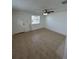 Living room with tile floors and ceiling fan at 4933 Filner St # 4933, New Port Richey, FL 34652