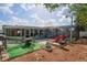 Backyard oasis with patio furniture, pool, and tropical mural at 3423 Umber Rd, Holiday, FL 34691