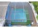 Enclosed pool area with safety enclosure and surrounding landscaping at 3423 Umber Rd, Holiday, FL 34691