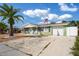 Charming ranch home with a green exterior, and mature landscaping at 3423 Umber Rd, Holiday, FL 34691