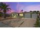 Attractive ranch home with a green exterior, and mature landscaping at 3423 Umber Rd, Holiday, FL 34691