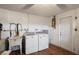 Laundry room with washer, dryer, and utility sink at 3423 Umber Rd, Holiday, FL 34691