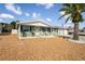 Charming ranch home with a green exterior, and mature landscaping at 3423 Umber Rd, Holiday, FL 34691