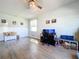 Hardwood floor living room with workspace and built-in shelving at 14512 Balloch Dr, Hudson, FL 34667