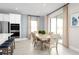 Kitchen dining area with table and chairs, and access to backyard at 8813 Starry Night Ter, Parrish, FL 34219