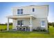 Two-story house with covered patio and landscaping at 8813 Starry Night Ter, Parrish, FL 34219