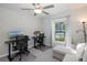 Home office with two desks, chairs, and a sofa at 13335 Crest Lake Dr, Hudson, FL 34669