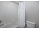 Bathroom with a shower/tub combo and white tile at 13335 Crest Lake Dr, Hudson, FL 34669