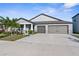 Two-story house with a two car garage, landscaping and driveway at 1836 Silver Star Pl, Ruskin, FL 33570