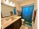 A bathroom with a mirror and wood-style floors at 10521 Mira Vista Dr, Port Richey, FL 34668