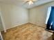 A bedroom featuring a ceiling fan and tile flooring throughout at 10521 Mira Vista Dr, Port Richey, FL 34668
