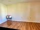 Bright room with neutral walls, vinyl floors, and ample space for versatile use at 10521 Mira Vista Dr, Port Richey, FL 34668