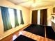 Open-concept room with natural light streaming in, neutral paint, and vinyl flooring at 10521 Mira Vista Dr, Port Richey, FL 34668