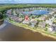 Stunning aerial view of the community highlighting the proximity to the lake and well-maintained homes at 12135 Crestridge Loop, Trinity, FL 34655