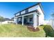 Charming backyard featuring a screened-in porch, offering an ideal space for relaxation and enjoying the outdoors at 12135 Crestridge Loop, Trinity, FL 34655