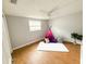 Bedroom featuring wood laminate flooring, ceiling fan and a colorful tent at 4041 Las Vegas Dr, New Port Richey, FL 34653