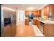 The kitchen showcases stainless steel appliances, sleek cabinets, and leads seamlessly into the adjacent dining area at 4041 Las Vegas Dr, New Port Richey, FL 34653