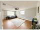 Bright living room with hardwood floors, neutral paint, and ceiling fan at 4041 Las Vegas Dr, New Port Richey, FL 34653