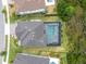 Aerial view of the home featuring a private, screened-in pool and lush backyard at 6120 Marsh Trail Dr, Odessa, FL 33556