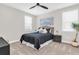 A cozy bedroom featuring a comfortable queen bed, neutral walls, and bright windows at 6120 Marsh Trail Dr, Odessa, FL 33556