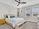 Bright bedroom with white walls, two windows, and neutral decor, offering a peaceful retreat at 6120 Marsh Trail Dr, Odessa, FL 33556