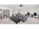 Cozy bonus room with modern furnishings, including a large sectional sofa at 6120 Marsh Trail Dr, Odessa, FL 33556