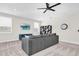 Comfortable bonus room with a sectional sofa and modern furniture at 6120 Marsh Trail Dr, Odessa, FL 33556
