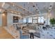 Spacious clubhouse interior with stylish seating, a bar area, and elegant decor at 6120 Marsh Trail Dr, Odessa, FL 33556