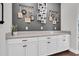 Stylish counter space with white cabinets, quartz countertops, and decorative wall hangings at 6120 Marsh Trail Dr, Odessa, FL 33556