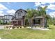 Inviting two-story home with a three-car garage, stone accents, and meticulously maintained landscaping at 6120 Marsh Trail Dr, Odessa, FL 33556