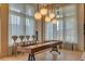 The game room features a shuffleboard table and high-top seating, perfect for entertaining guests at 6120 Marsh Trail Dr, Odessa, FL 33556