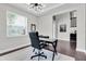 Bright home office with a modern desk, comfortable chair, and ample natural light at 6120 Marsh Trail Dr, Odessa, FL 33556