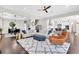 The living room with a view of the dining and kitchen area features lots of natural light at 6120 Marsh Trail Dr, Odessa, FL 33556