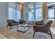 Inviting lounge area featuring comfortable seating, stylish tables, and abundant natural light from large windows at 6120 Marsh Trail Dr, Odessa, FL 33556