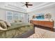 Stylish main bedroom with dark wood floors, large windows, and decorative shelving at 6120 Marsh Trail Dr, Odessa, FL 33556