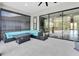 Comfortable outdoor patio with lounge seating, sliding glass doors and peaceful ambiance at 6120 Marsh Trail Dr, Odessa, FL 33556