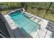 Stunning private pool area with slide, hot tub and lush landscaping at 6120 Marsh Trail Dr, Odessa, FL 33556
