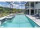 Resort-style pool with spa, sun loungers, and beautiful view surrounded by screened lanai at 6120 Marsh Trail Dr, Odessa, FL 33556