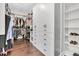 Spacious walk-in closet with custom shelving and ample storage space at 6120 Marsh Trail Dr, Odessa, FL 33556