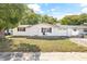 Newly renovated ranch-style home with white brick exterior and attached garage at 7240 Nova Scotia Dr, Port Richey, FL 34668