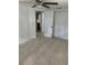 A bedroom that includes ceiling fan and closet space at 7240 Nova Scotia Dr, Port Richey, FL 34668