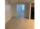 Neutral toned dining area featuring tile floors and leading into a naturally lit room, perfect for everyday meals at 7240 Nova Scotia Dr, Port Richey, FL 34668