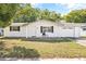 Newly renovated ranch-style home with white brick exterior and attached garage at 7240 Nova Scotia Dr, Port Richey, FL 34668