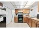 A kitchen featuring wooden cabinets and updated appliances at 7240 Nova Scotia Dr, Port Richey, FL 34668